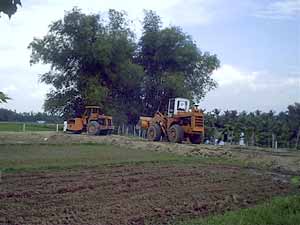 payloader and vibrator/roller