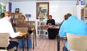 Priest teaching class