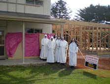 Dominican Sisters standing by new construction