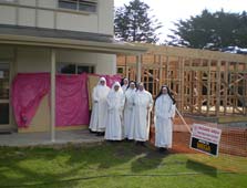 Dominican Sisters standing by new construction