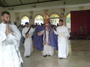 Bishop Williamson blessing the floor of Jaro Church
