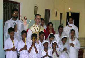 Fr. Couture with child converts