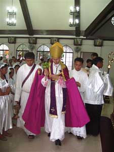 Bishop Tissier consecrating a church