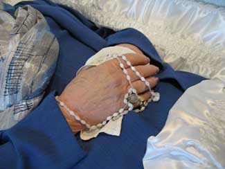 The hands of the mother of a priest